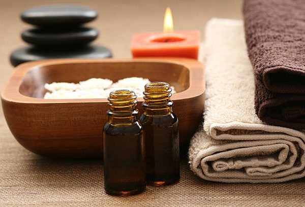 essential oils flowers and towels - body care